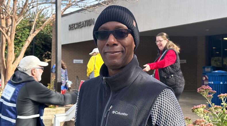 Alonzie Scott, a recently retired federal worker, is seen at an Arlington, Va., polling center on Tuesday, Nov. 4th, 2025. (AP Photo/Helen Wieffering)
