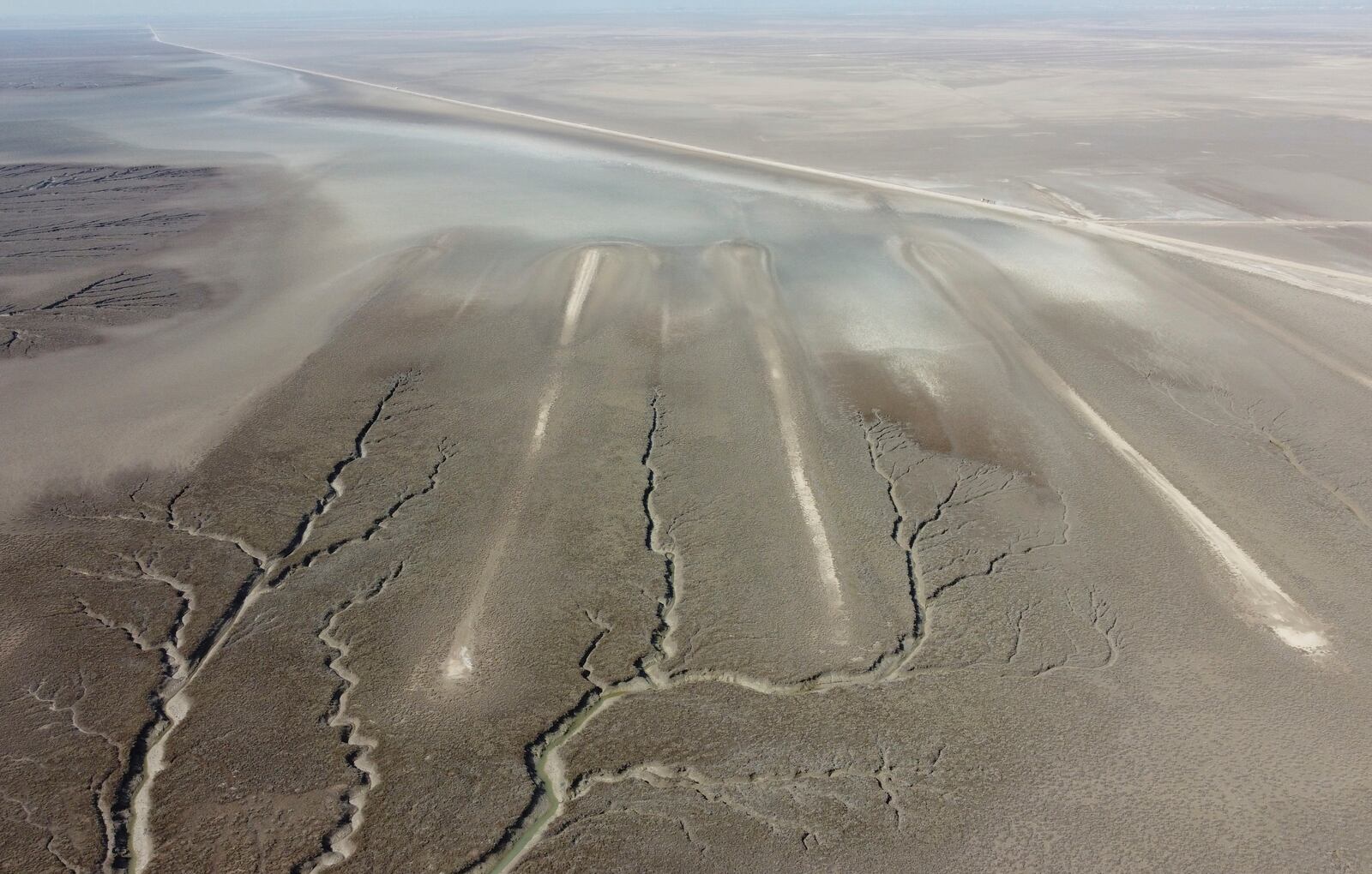 An aerial photo shows an archaeological site where researchers dated some of the massive earthen structures, believed to have been built with slave labor, and found that their construction spanned several centuries, near Basra, Iraq, Saturday, Jan. 29, 2022. (AP Photo/Jaafar Jotheri)