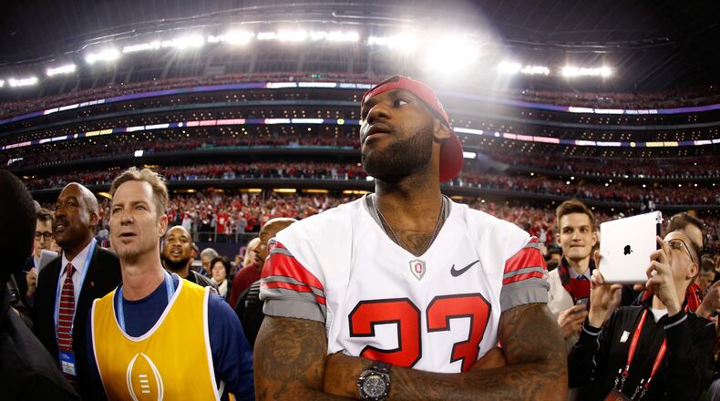 ARLINGTON, TX - JANUARY 12: LeBron James of the Cleveland Cavaliers looks on after the Ohio State Buckeyes defeated the Oregon Ducks 42 to 20 in the College Football Playoff National Championship Game at AT&T Stadium on January 12, 2015 in Arlington, Texas. (Photo by Christian Petersen/Getty Images)