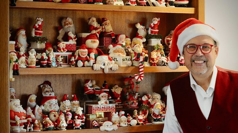 Michael Roediger, director of the Dayton Art Institute, collects Santa figures and has a collection of 500 of them. MARSHALL GORBY\STAFF