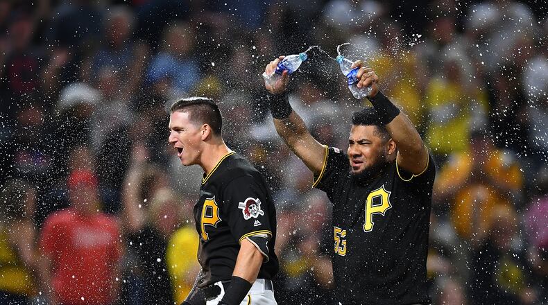 PITTSBURGH, PA - SEPTEMBER 27: Kevin Newman #27 of the Pittsburgh Pirates celebrates his two run home run with Melky Cabrera #53 during the ninth inning against the Cincinnati Reds at PNC Park on September 27, 2019 in Pittsburgh, Pennsylvania. (Photo by Joe Sargent/Getty Images)