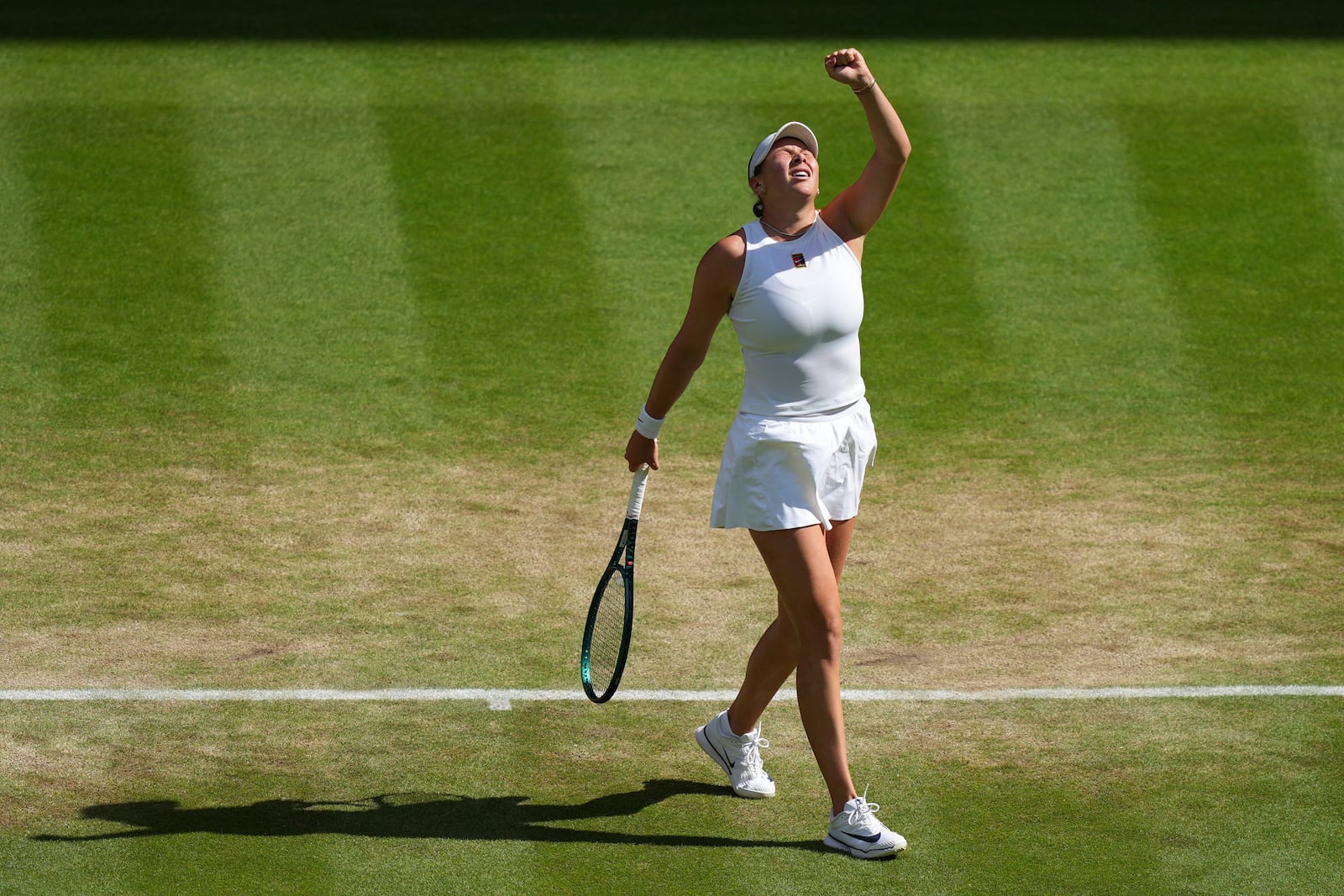 Amanda Anisimova of the U.S. celebrates winning a point against Aryna Sabalenka of Belarus during a women's singles semifinal match at the Wimbledon Tennis Championships in London, Thursday, July 10, 2025. (AP Photo/Joanna Chan)