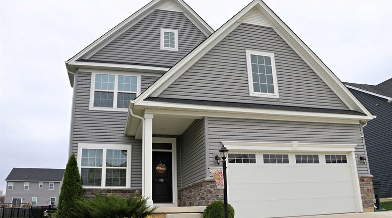 Built in 2021 within the River Reserve neighborhood of Beavercreek Twp., this vinyl-sided home at 2806 River Oaks Court has about 2,458 square feet of living space with an open main level, flex-space front room, and a finished basement with an egress window. CONTRIBUTED