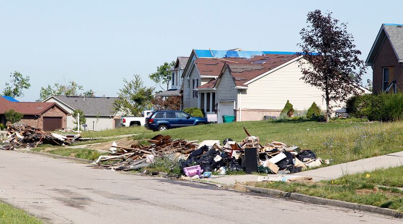 Damaged home debris along Butterfield Drive in Beavercreek nearly two months after the Memorial Day tornadoes ripped through the area in 2019. TY GREENLEES / STAFF