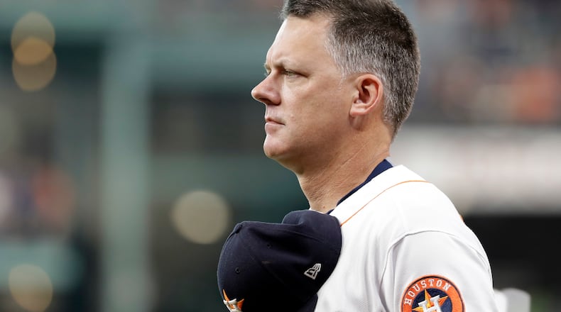 Houston Astros manager A.J. Hinch listens to the National Anthem before a baseball game against the Los Angeles Angels Saturday, June 10, 2017, in Houston. (AP Photo/David J. Phillip)