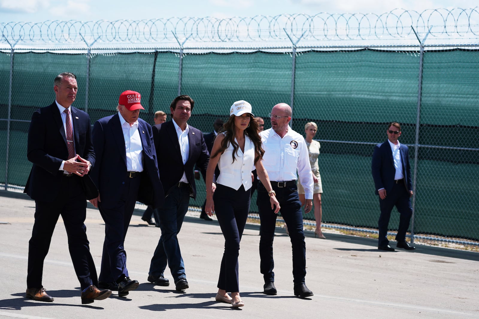 President Donald Trump, Gov. Ron DeSantis, R-Fla., Homeland Security Secretary Kristi Noem and others, tour "Alligator Alcatraz," a new migrant detention facility at Dade-Collier Training and Transition facility, Tuesday, July 1, 2025, in Ochopee, Fla. (AP Photo/Evan Vucci)