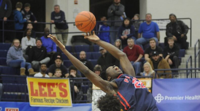 Findlay’s Nathan Mensah (top). Findlay Prep (Nev.) defeated Huntington Prep (W.Va.) 50-48 in the 16th Annual Premiere Health Flyin’ to the Hoop at Fairmont’s Trent Arena in Kettering on Fri., Jan. 12, 2018. MARC PENDLETON / STAFF