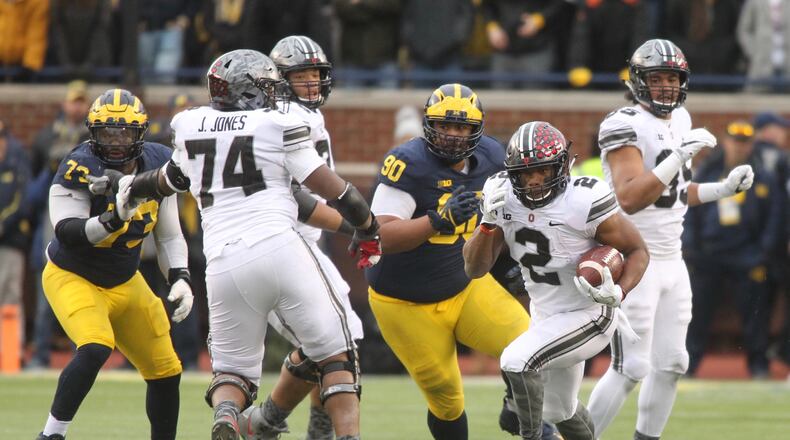 Ohio State’s J.K. Dobbins runs against Michigan on Saturday, Nov. 25, 2017, at Michigan Stadium in Ann Arbor. David Jablonski/Staff