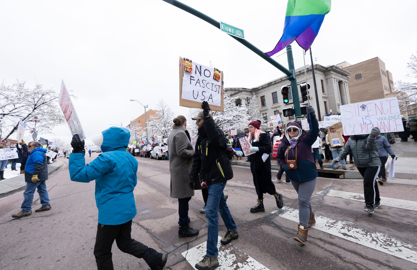 Demonstrators march in downtown Colorado Springs, Colo., Saturday, April 19, 2025, during a local Day of Action and Protest! demonstration outside the Colorado Springs City Hall. (Christian Murdock/The Gazette via AP)