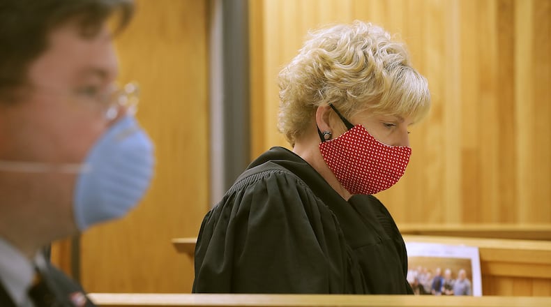 Judge Denise Moody and her staff were wearing face coverings Monday as they conducted court. The Clark County Courts are now open, however, face coverings are required to enter. BILL LACKEY/STAFF