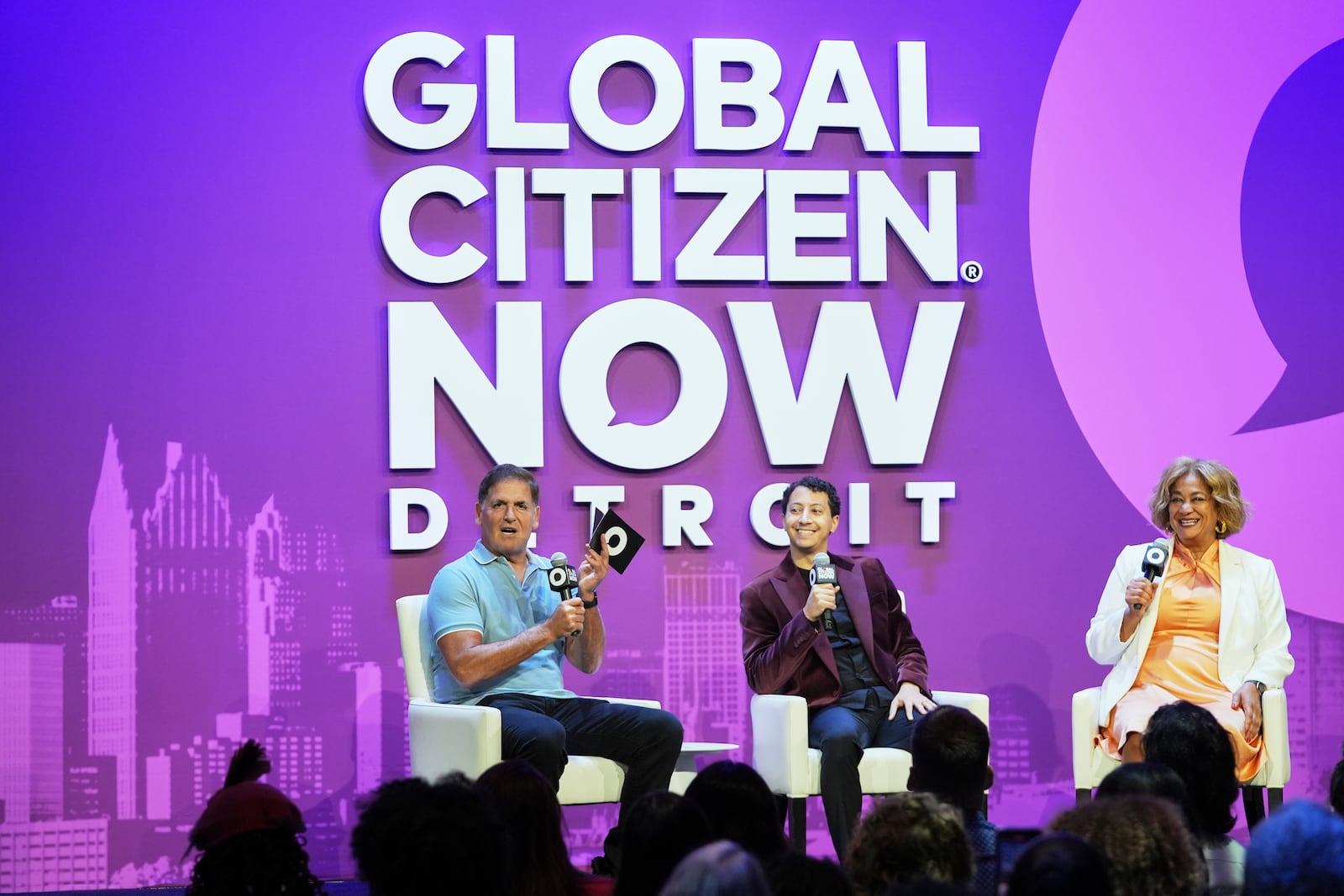 Mark Cuban, from left, Andrew Leon Hanna, and Anika Goss speak on a panel at a Global Citizen NOW event in Detroit, Thursday, July 10, 2025. (AP Photo/Paul Sancya)