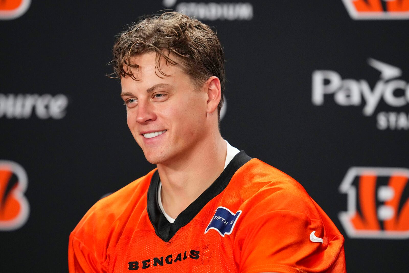 Cincinnati Bengals' Joe Burrow (9) speaks during a press conference following practice at the team's NFL football training camp, Wednesday, July 23, 2025, in Cincinnati. (AP Photo/Jeff Dean)