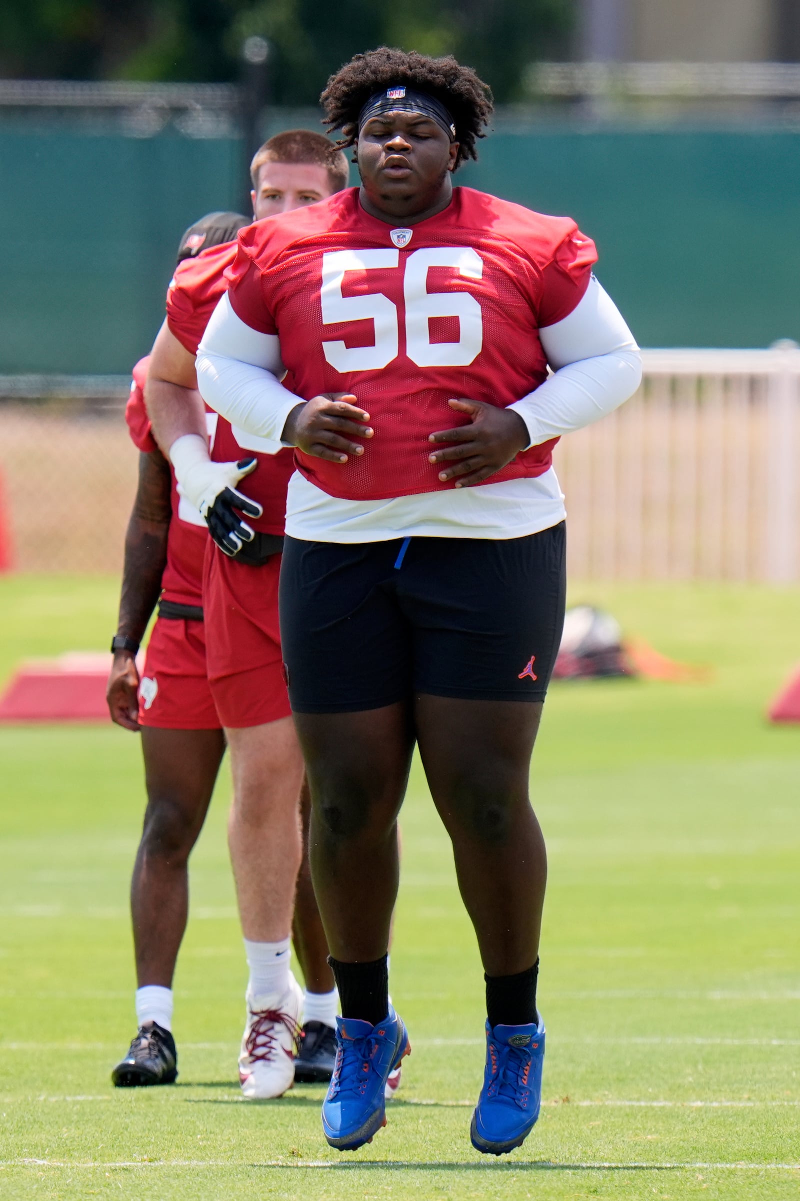 Tampa Bay Buccaneers nose tackle Desmond Watson (56) runs through a drill during the NFL football team's rookie minicamp Friday, May 9, 2025, in Tampa, Fla. (AP Photo/Chris O'Meara)