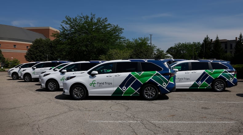 Field Trips By Via vehicles sit in a parking lot of Clark County Public Library on Tuesday, July 8, 2025. JOSEPH COOKE/STAFF