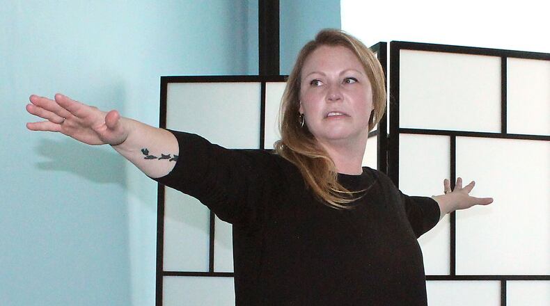 Blue Yoga owner, Rachel Summers leads a yoga class in her studio in Springfield. JEFF GUERINI/STAFF