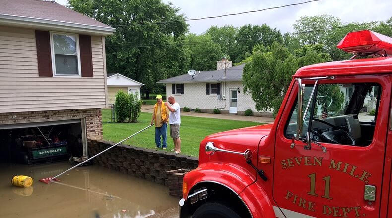 File photo of the Seven Mile Fire Department in Butler County pumping water out of homes along Taylor School Road. NICK GRAHAM/STAFF