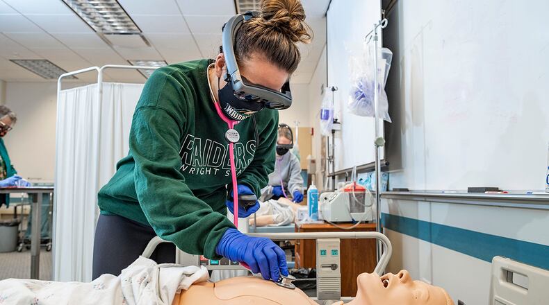Wright State University nursing students use augmented reality to better assess patients, with virtual hearts, lungs and other internal body parts coming to life to enhance the learning experience. Contributed photo/Wright State University