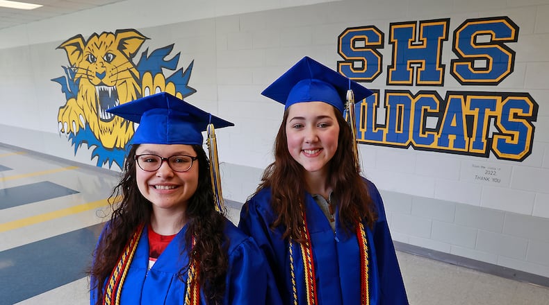 Bobbi-Jo Arnold-Diaz, the Springfield High School valedictorian, left, and Sadie Hatton, the salutatorian, pose for pictures Thursday, May 4, 2023. Fifteen years ago, North and South high schools merged to become Springfield High School. BILL LACKEY/STAFF