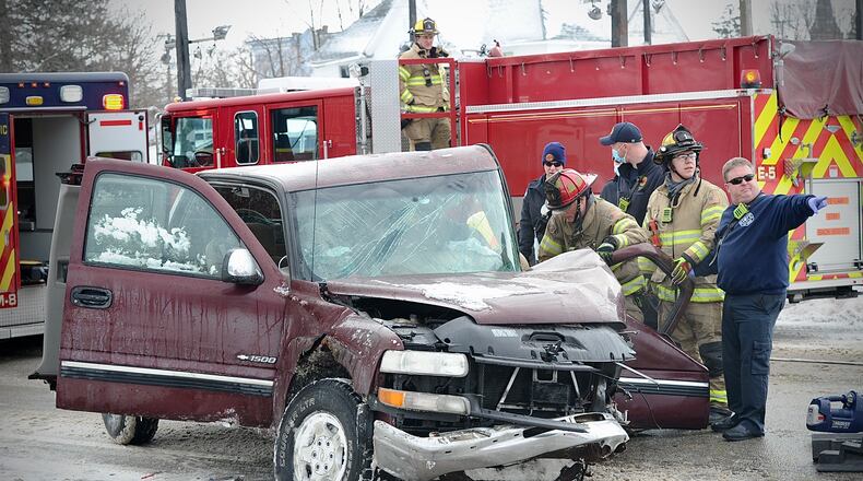 The driver of a pickup truck was trapped after crashing into a tree late Friday morning, Feb. 4, 2022, on Columbia Street in Springfield. MARSHALL GORBY/STAFF