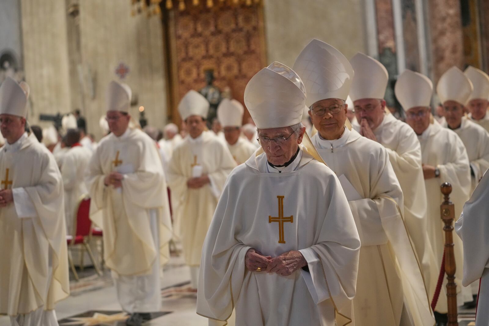 FILE - Cardinals leave at the end of a Mass on the eighth of nine days of mourning for Pope Francis, in St. Peter's Basilica, at the Vatican, Saturday, May 3, 2025. (AP Photo/Alessandra Tarantino, File)
