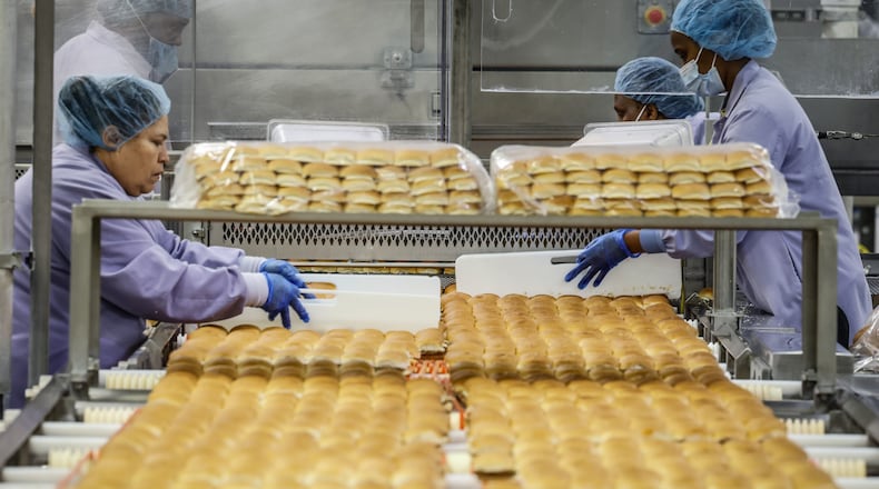 Works at the White Castle Vandalia plant box-up over a million hamburgers at day. JIM NOELKER/STAFF