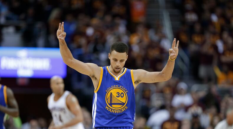 Golden State Warriors guard Stephen Curry (30) celebrates a basket against the Cleveland Cavaliers during the second half of Game 4 of basketball's NBA Finals in Cleveland, Friday, June 10, 2016. (AP Photo/Tony Dejak)