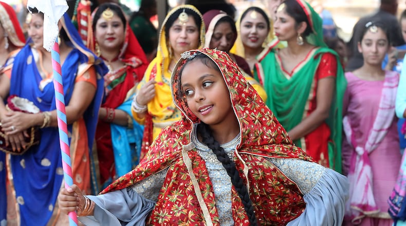 A young dancer with the Punjabi Bhangra dance group starts out the group's performance during CultureFest 2019 in downtown Springfield. The 2020 event was canceled due to the coronavirus pandemic. Springfield city leaders developed CultureRead 2020 to replace it and will have a follow up to that event this week. BILL LACKEY/STAFF