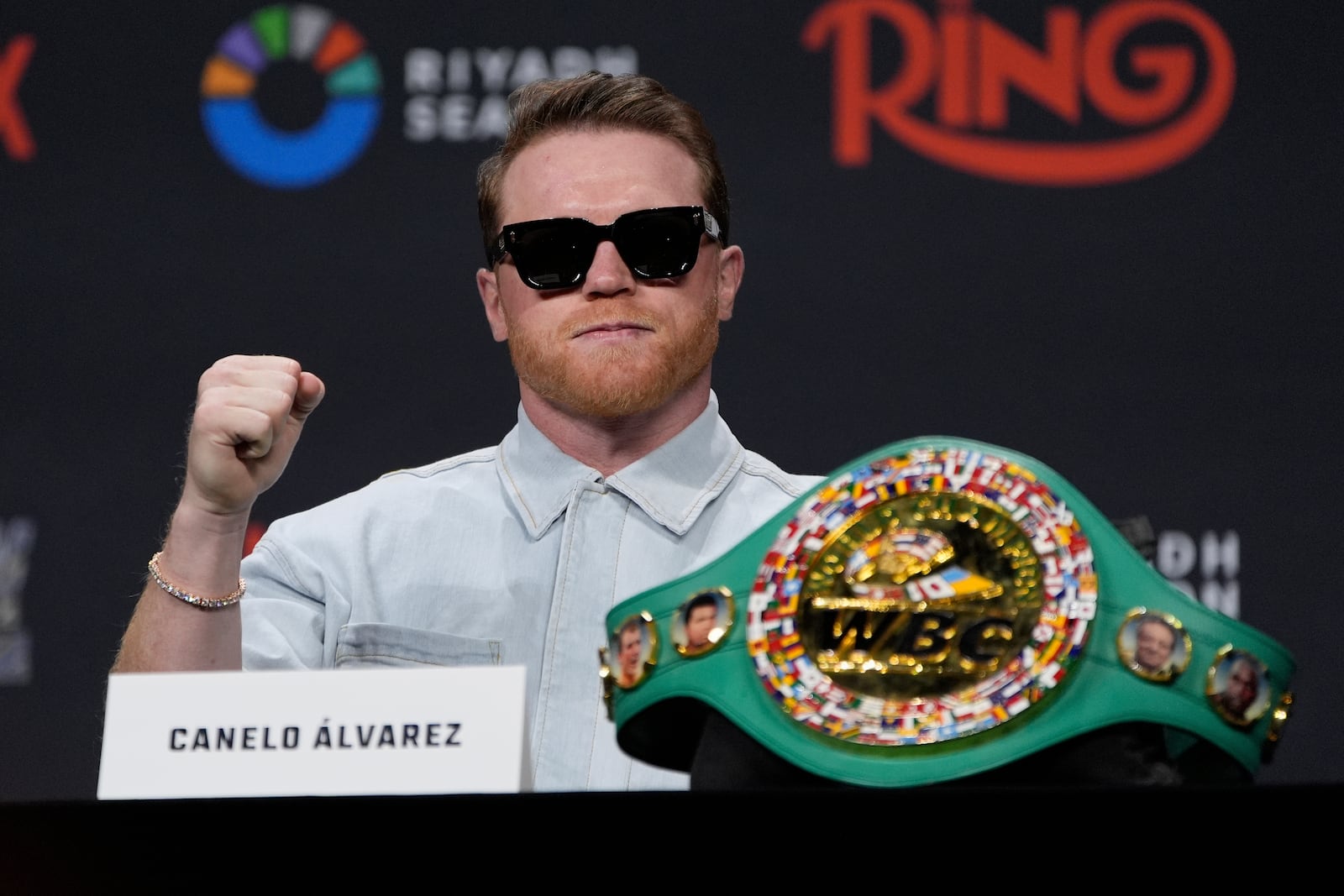 Canelo Alvarez motions during a news conference Friday, June 27, 2025, in Las Vegas. (AP Photo/John Locher)