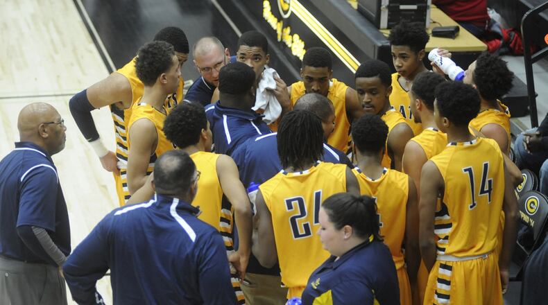 The Wildcats regroup with head coach Isaiah Carson. Springfield defeated host Centerville 46-40 in a boys high school basketball game last month. MARC PENDLETON / STAFF