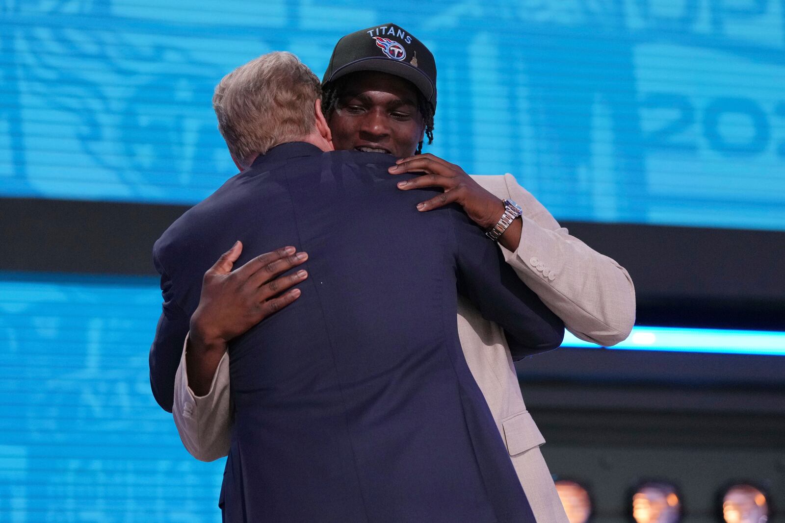 Miami quarterback Cam Ward, right, embraces NFL Commissioner Roger Goodell after being chosen by the Tennessee Titans with the first overall pick during the first round of the NFL football draft, Thursday, April 24, 2025, in Green Bay, Wis. (AP Photo/Jeff Roberson)