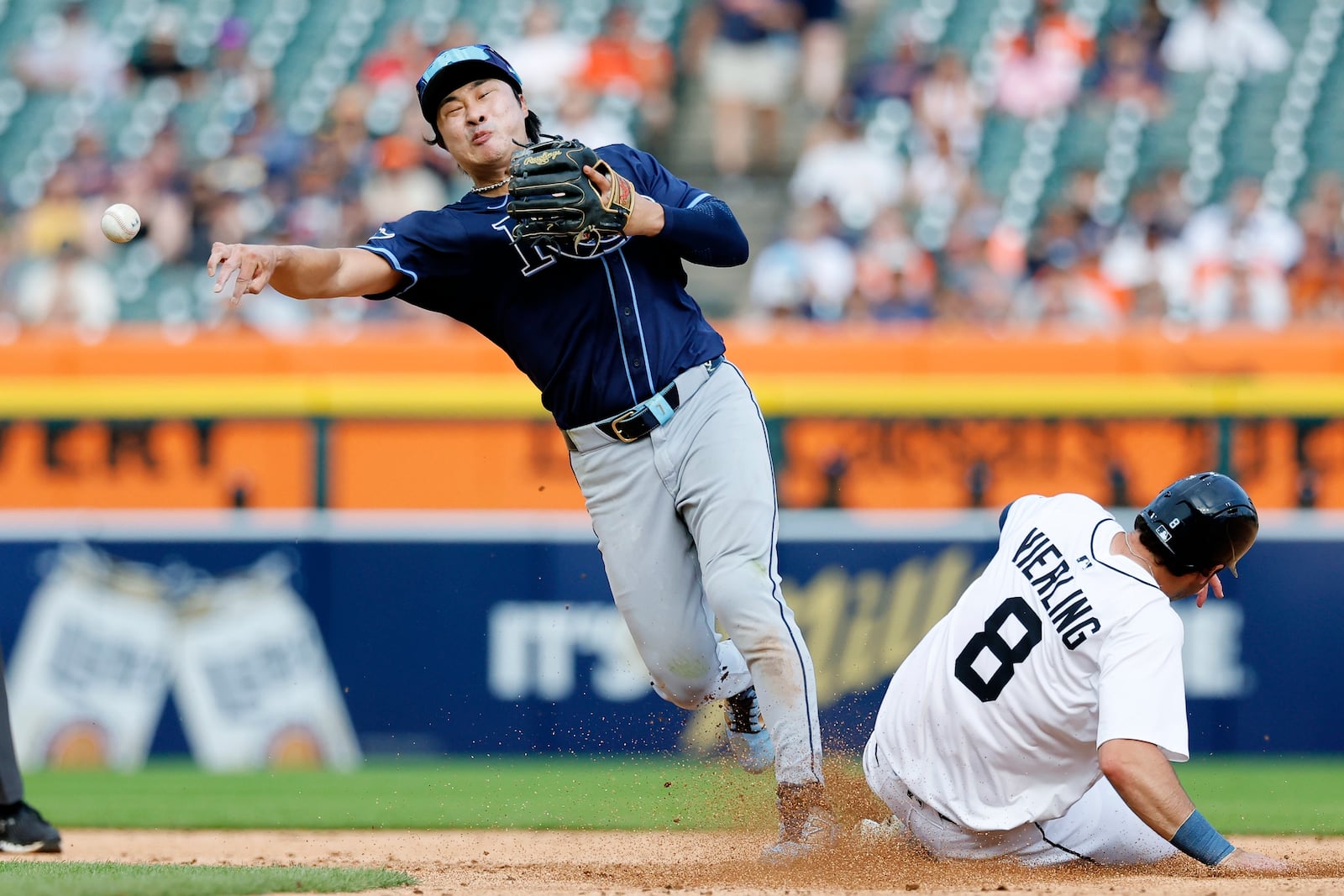 Tampa Bay Rays shortstop Ha-Seong Kim turns the ball after getting a force out on Detroit Tigers' Matt Vierling during the fourth inning of a baseball game Wednesday, July 9, 2025, in Detroit. (AP Photo/Duane Burleson)