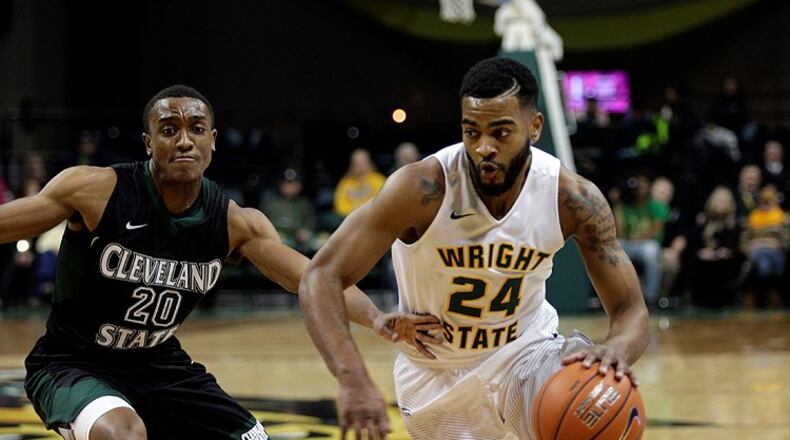 Wright State’s Mark Alstork tries to maneuver past Cleveland State’s Bobby Word during their game at the Nutter Center last season. TIM ZECHAR / CONTRIBUTED