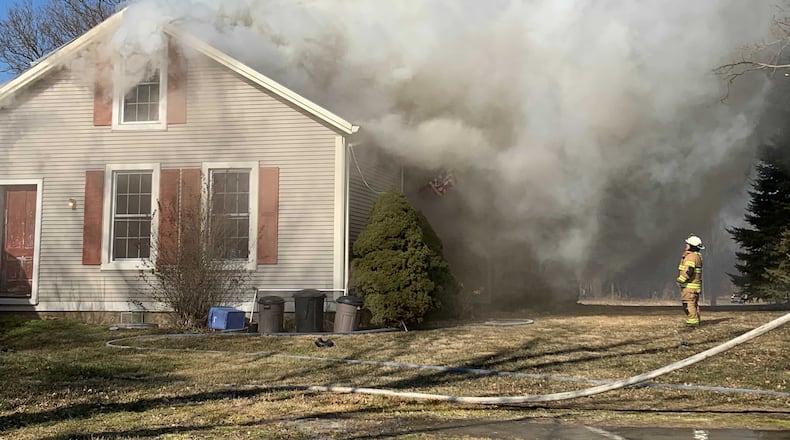 Heavy smoke and flames were reported at at a house fire on New Love Road in Harmony Twp. on Friday, Jan. 29. 2021. BILL LACKEY/STAFF