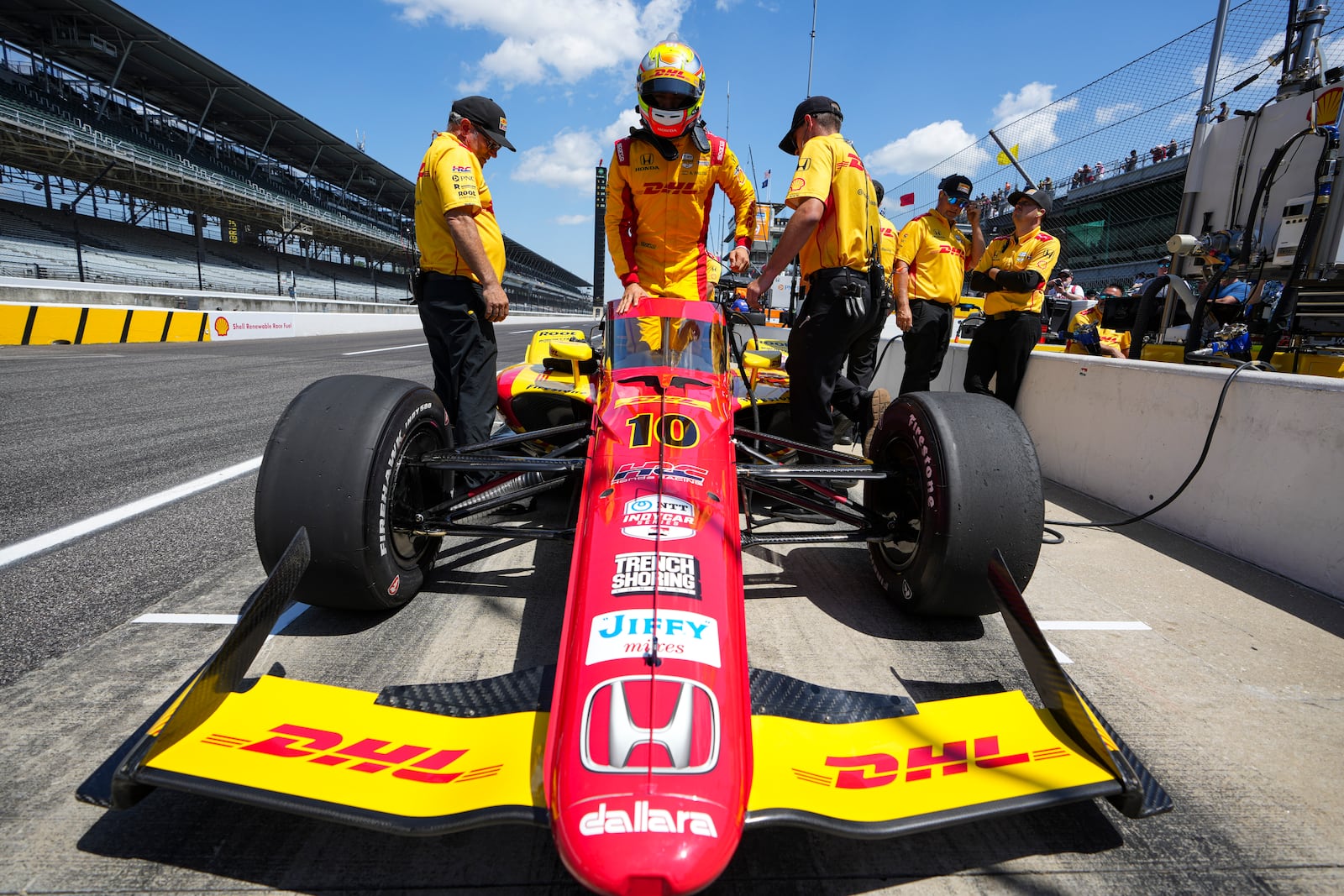 Alex Palou, of Spain, climbs into his car during practice for the Indianapolis 500 auto race at Indianapolis Motor Speedway in Indianapolis, Friday, May 16, 2025. (AP Photo/Michael Conroy)
