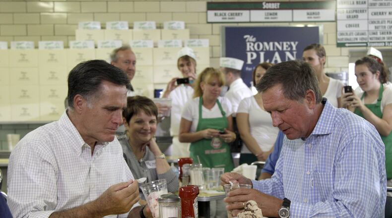 In this Aug. 14, 2012 photo, former Massachusetts Gov. Mitt Romney and Ohio Gov. John Kasich at Tom’s Ice Cream Bowl in Zanesville during the 2012 presidential election. (AP Photo/Mary Altaffer, File)