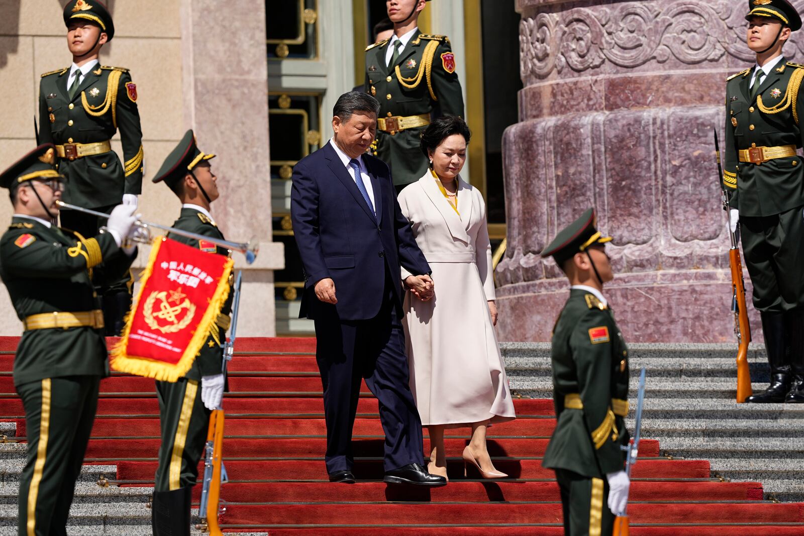 Chinese President Xi Jinping, center left, and his wife Peng Liyuan attend the welcome ceremony for Kenyan President William Ruto at the Great Hall of the People in Beijing Thursday, April 24, 2025. (Iori Sagisawa/Pool Photo via AP)
