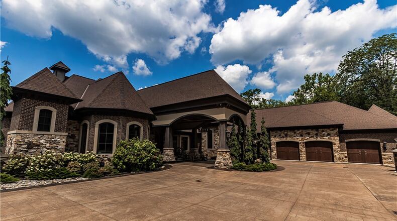 This resort-style 15, 246 Sq Ft Colorado cabin inspired estate features 4 bedrooms and sits on a 3.5 acre lot. It has high end finishes and rustic details. It is in the Auteur Estates subdivision in Clearcreek Township. CONTRIBUTED