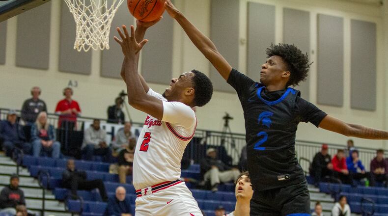 Fairfield's Deshawne Crim drives for two points against Richmond Heights' Demaris Winters Jr. during Monday's game at Flyin' To The Hoop at Fairmont High School's Trent Arena. CONTRIBUTED/Jeff Gilbert
