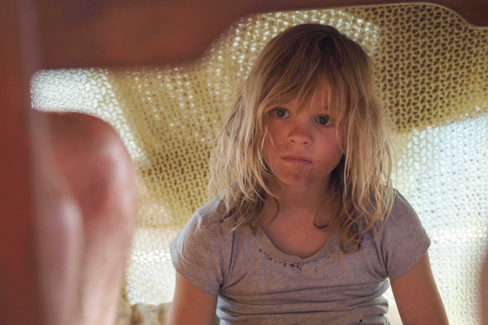 This image released by Sony Pictures Classics shows Lexi Venter in a scene from "Don’t Let’s Go to the Dogs Tonight." (Coco Van Oppens/Sony Pictures Classics via AP)