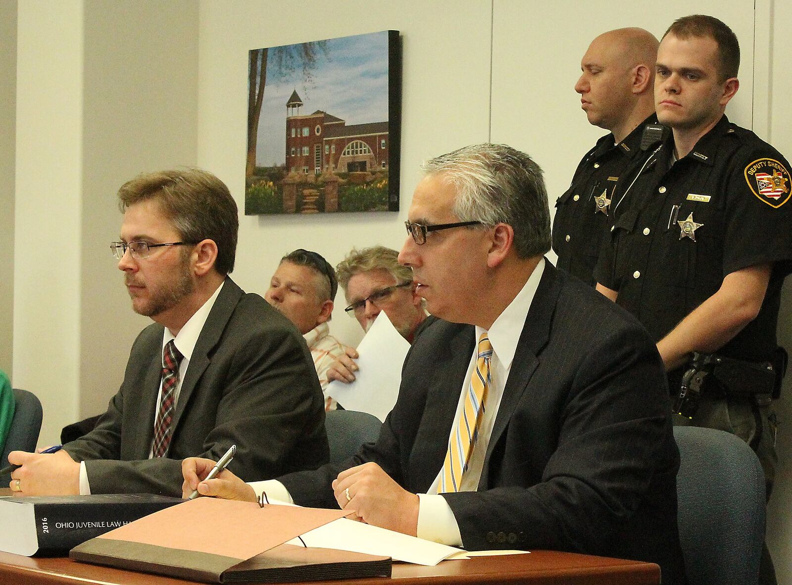 Champaign County Prosecutor, Kevin Talebi (right) and Assistant Prosecutor Benjamin Hoskinson listen to Juvenile Court Judge Lori Reisinger in a hearing involving murder charges against 14 year old Donovan Nicholas. JEFF GUERINI/STAFF