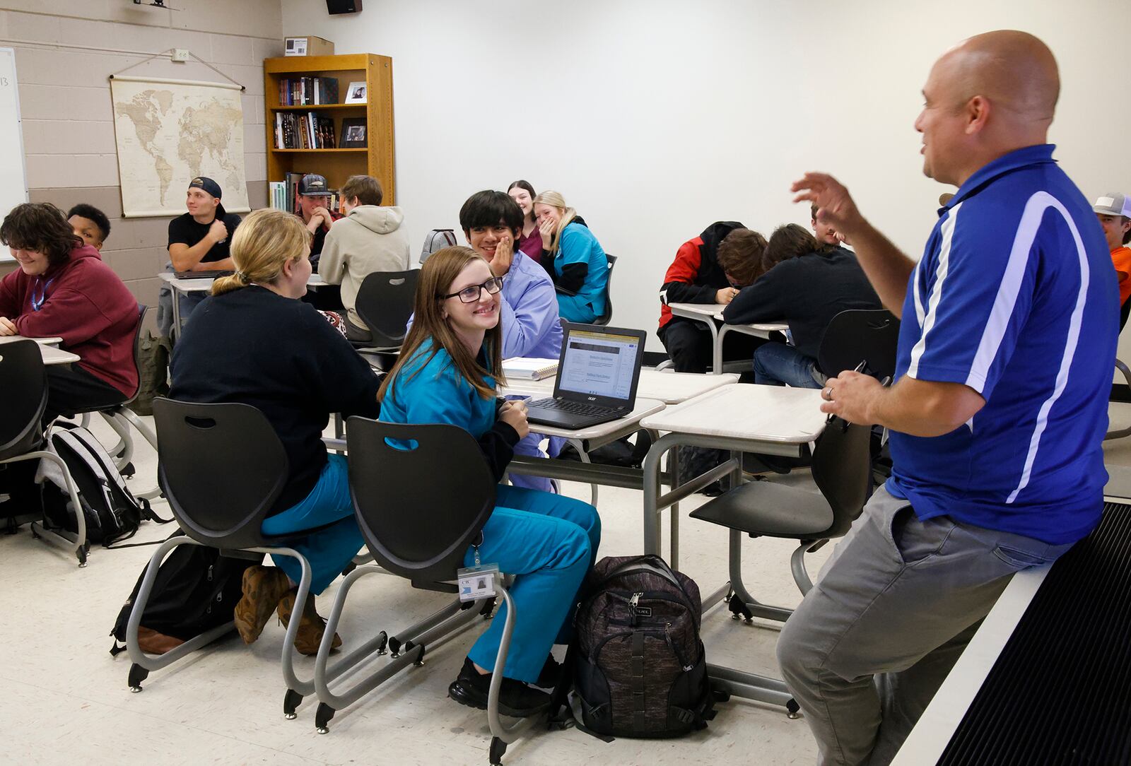 Christian Davoli teaches a Government class in a crowded classroom at the Springfield-Clark Career Technology Center.  BILL LACKEY/STAFF