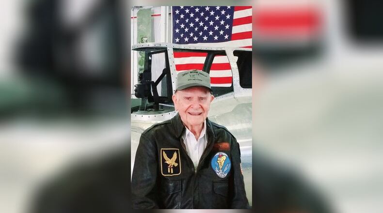 World War II veteran Art Kemp standing in front of his tailgunner position, wearing a 351st Bomb Group hat, and a leather A2 flight jacket with the symbols of the 351st Bomb Group and also his bomb squadron. Contributed/Greg Schafer