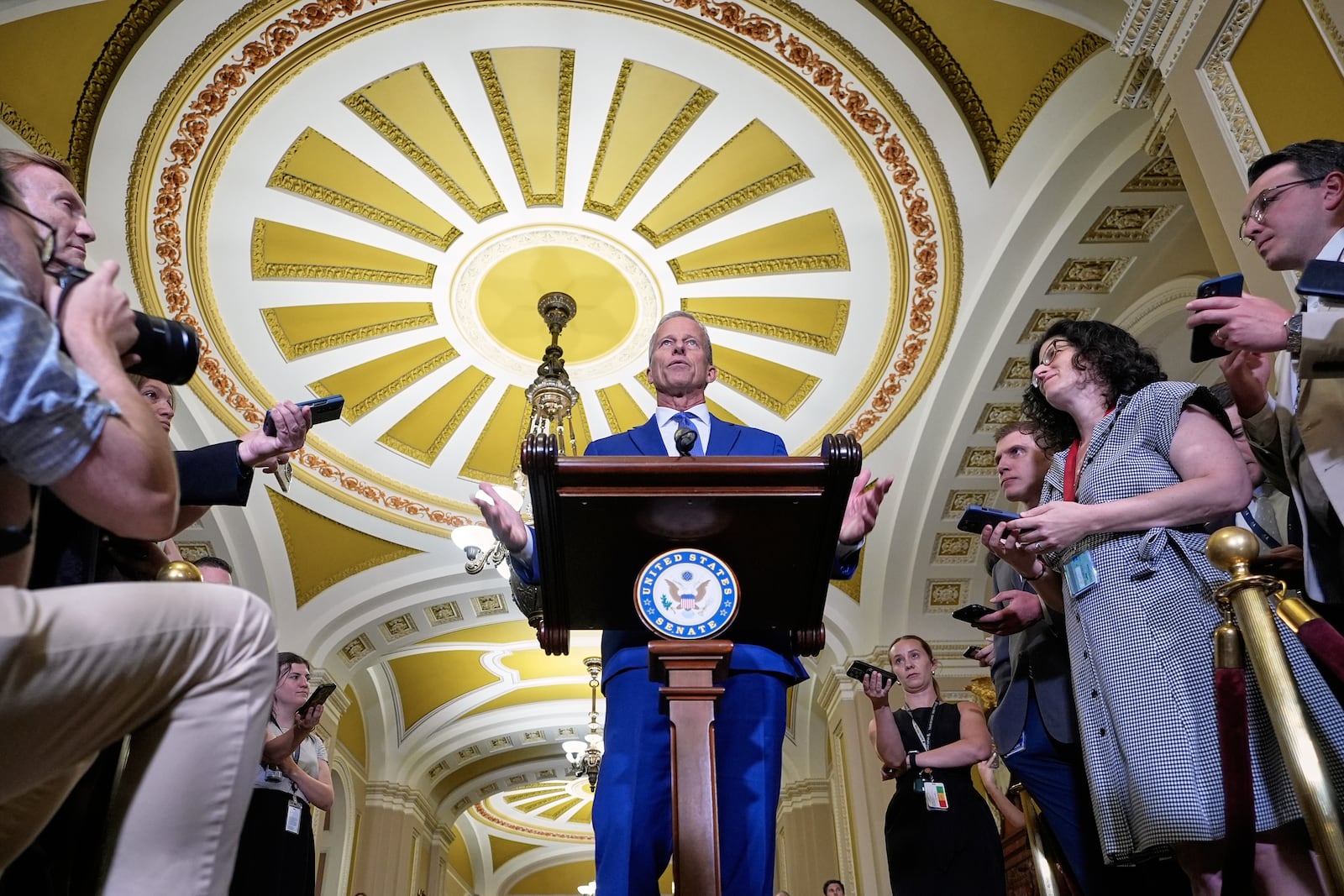 Sen. Majority Leader John Thune, R-S.D., center, talks after a policy luncheon on Wednesday, July 9, 2025, at the Capitol in Washington. (AP Photo/Mariam Zuhaib)