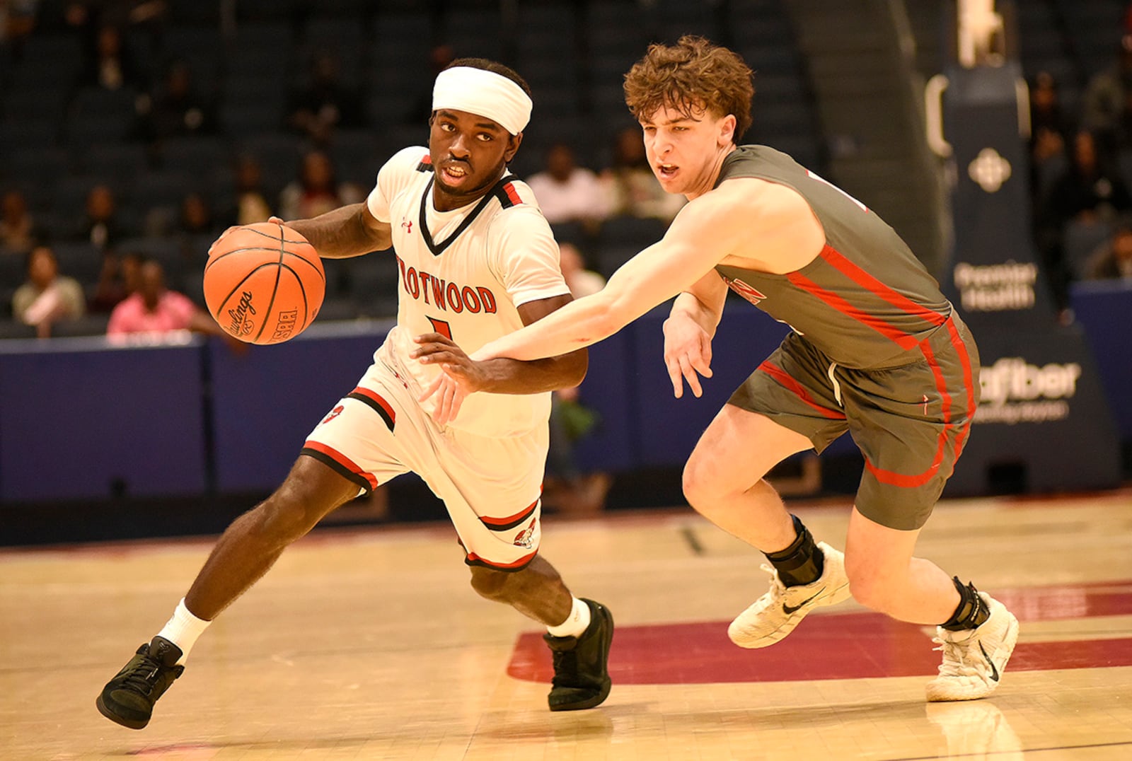 Trotwood-Madison High School senior guard Je'Carious Reaves dribbles the ball down the court during their Division III district final game against Goshen on Saturday, March 7, 2026 at the University of Dayton Arena. GEOFF NEVILLE / CONTRIBUTED PHOTO