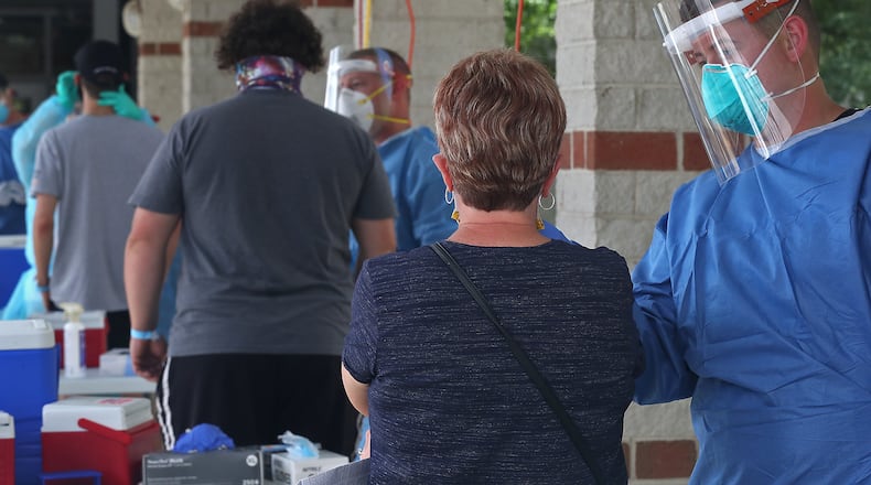 Several hundred people showed up the be tested during the Clark County Combined Health Department's free COVID-19 clinic at Perrin Woods Elementary School on July 15. BILL LACKEY/STAFF