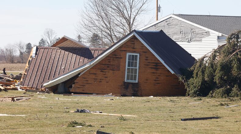 The roof of a garage was picked up in Wednesday's tornado and dropped in a backyard along Mitchell Road. BILL LACKEY/STAFF