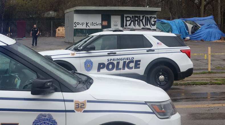 Springfield police investigate a homicide at a homeless encampment at 901 West Main Street Wednesday, April 6, 2022. BILL LACKEY/STAFF