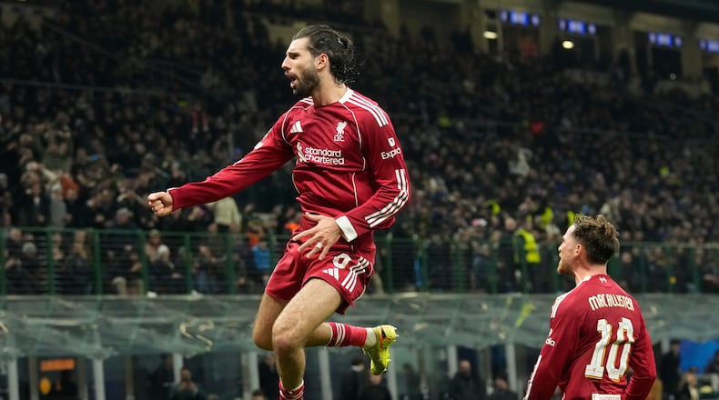 Liverpool's Dominik Szoboszlai celebrates after scoring his side's first goal from a penalty shot during a Champions League, league phase, soccer match between Inter Milan and Liverpool in Milan, Italy, Tuesday, Dec.9, 2025. (AP Photo/Luca Bruno)