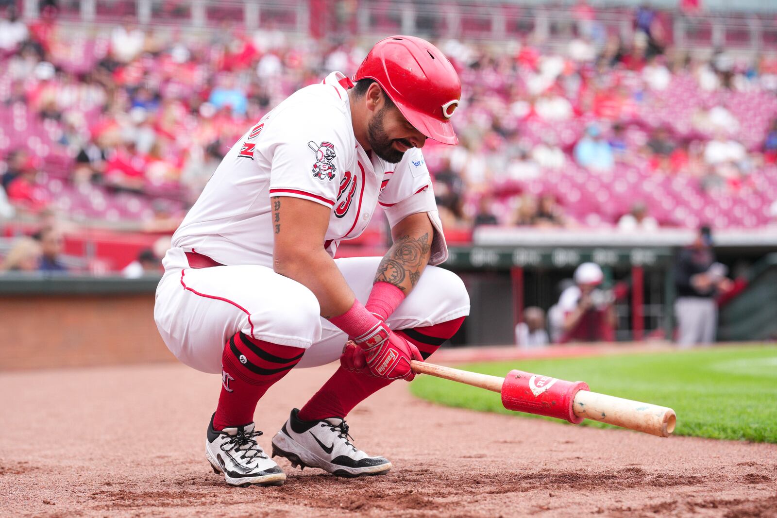 Cincinnati Reds' Christian Encarnacion-Strand warms up during the 10th inning of a baseball game against the Arizona Diamondbacks that was suspended Friday because of rain and resumed, Saturday, June 7, 2025, in Cincinnati. (AP Photo/Jeff Dean)