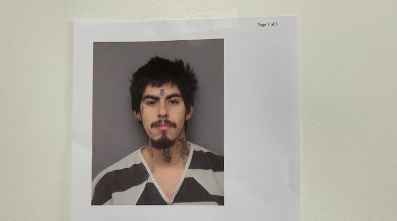 A mugshot of fatal stabbing suspect Antonio Depriest is taped to a wall at Springfield Police Division headquarters Monday, Nov. 3, 2025. JESSICA OROZCO/STAFF